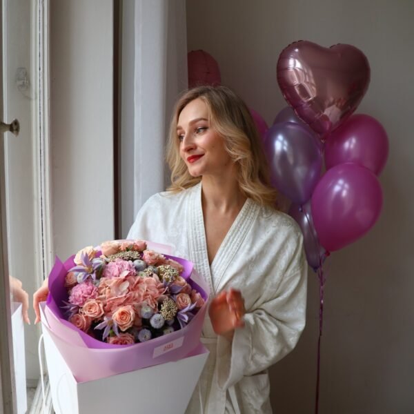 A bouquet of light pink roses, chrysanthemums and carnations
