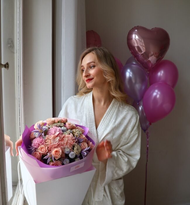 A bouquet of light pink roses, chrysanthemums and carnations
