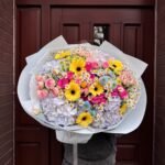 A bouquet of hydrangeas, gerberas and spray roses