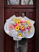 A bouquet of hydrangeas, gerberas and spray roses