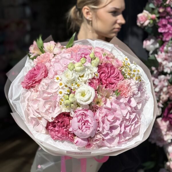 A bouquet of pink hydrangeas, peonies and peony roses