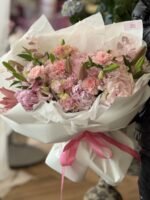 A bouquet of pink hydrangeas, lilies and garden roses
