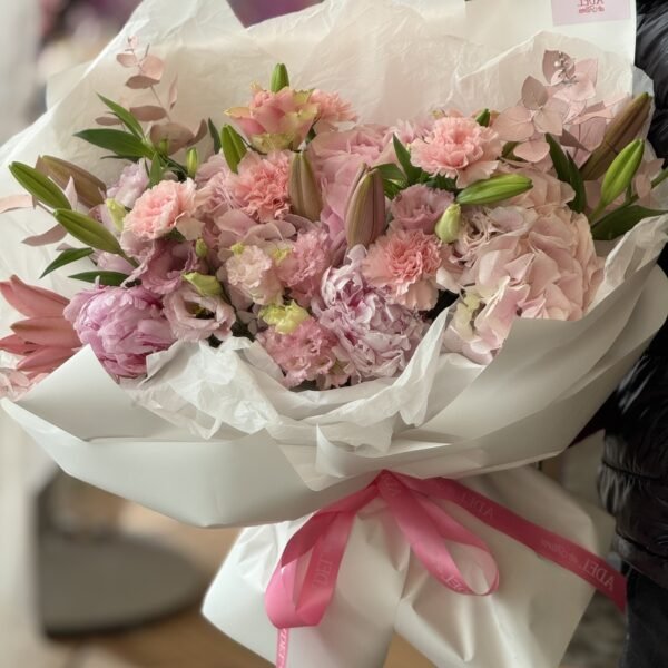 A bouquet of pink hydrangeas, lilies and garden roses