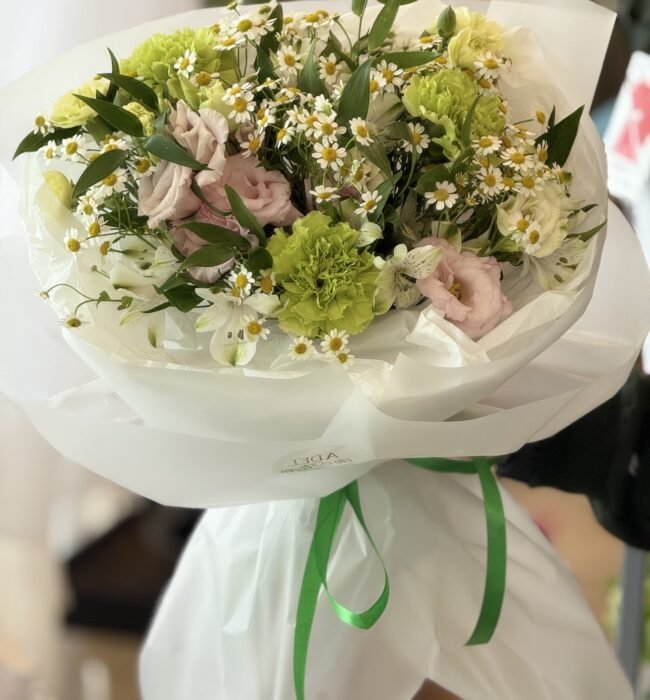 A bouquet of green carnations, eustomas and alstroemerias
