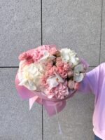 A bouquet of hydrangeas, orchids and spray roses