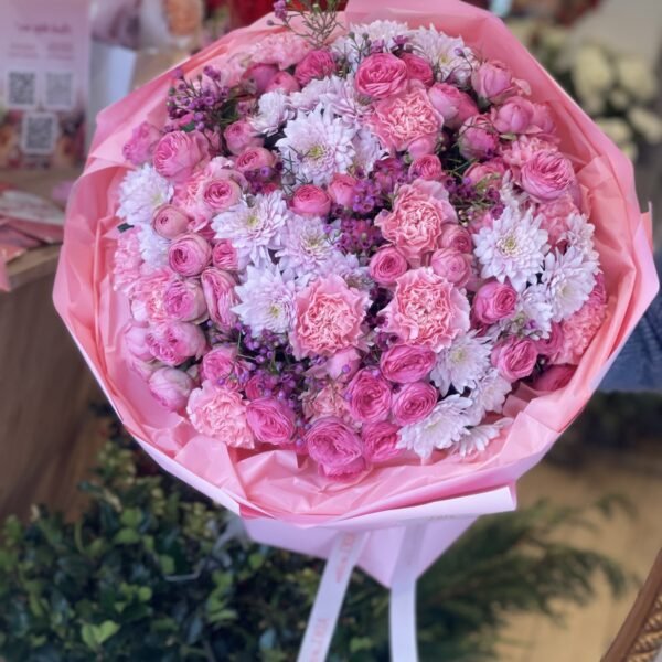 A bouquet of spray roses, carnations and chrysanthemums