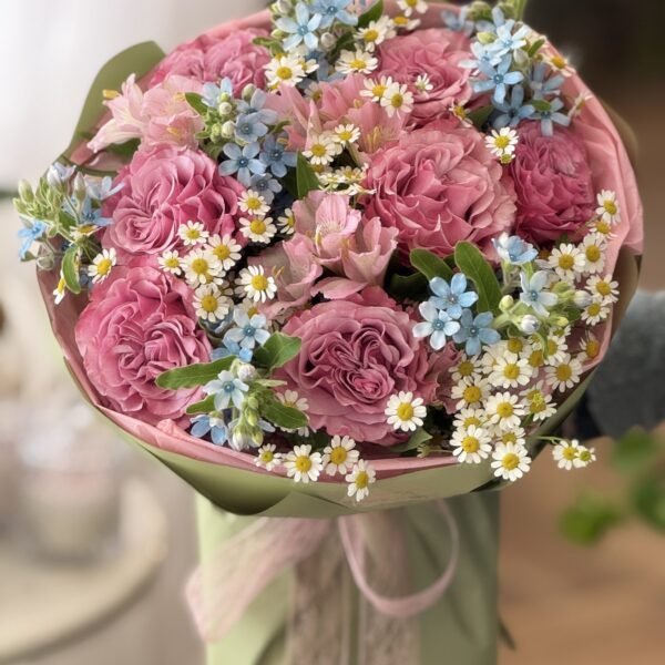A bouquet of garden roses, alstroemerias and oxypetalums