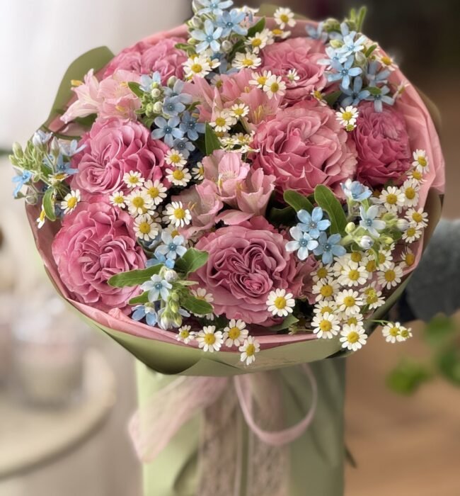 A bouquet of garden roses, alstroemerias and oxypetalums