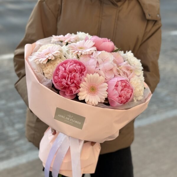 A bouquet of pink peonies, gerberas and hydrangeas