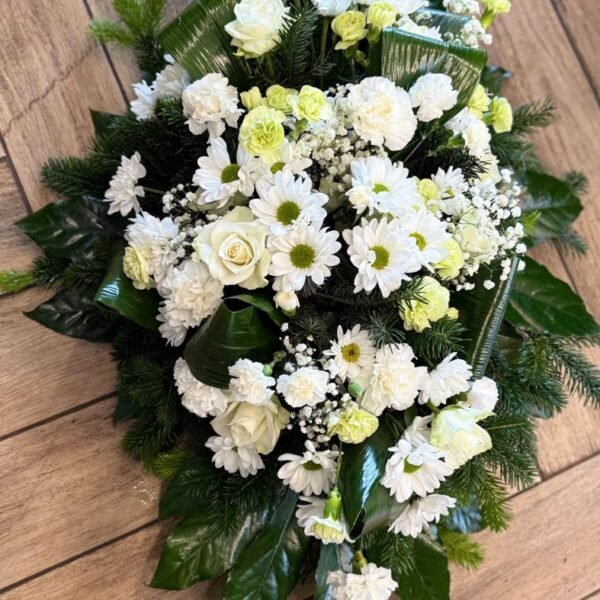 A funeral arrangement of white roses — Adel de Flores