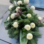 A funeral bouquet of white chrysanthemums — Adel de Flores